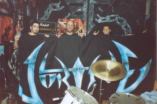 The author and guitarist Gustavo (right) in bands rehearsal room, with backdrops of VORTICE and ESCAPE LIBRE (above)